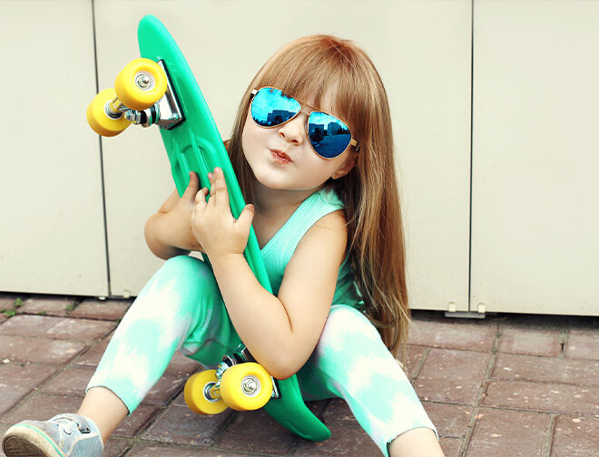 Young girl with sunglasses and penny board