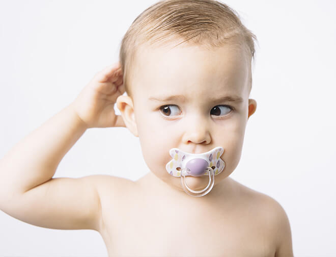Baby with pacifier in mouth
