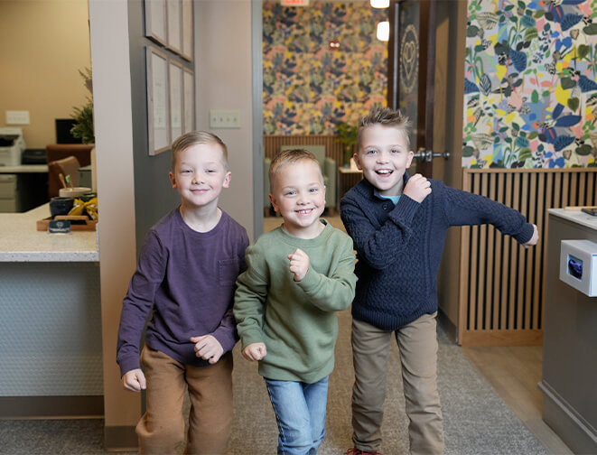 Three happy boys in dentists' office